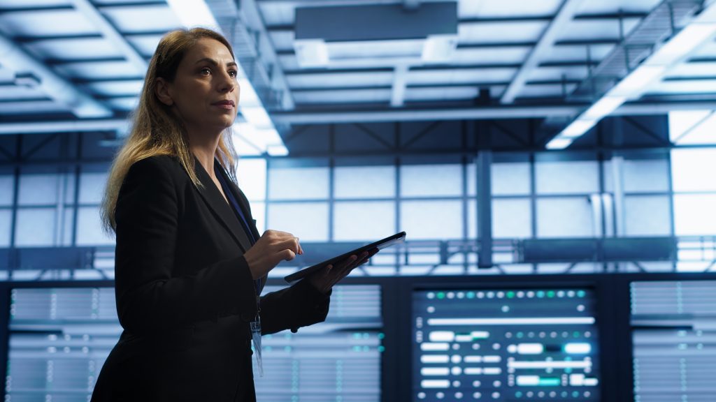 woman data center making sure rigs are functioning optimally